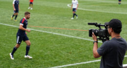 Cameraman catches the person using laser light on players in a football match